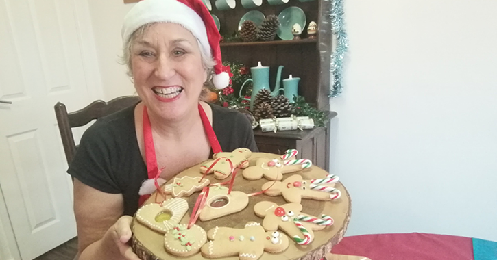 British Bake Off star Karen Wright holding Christmas gingerbread 